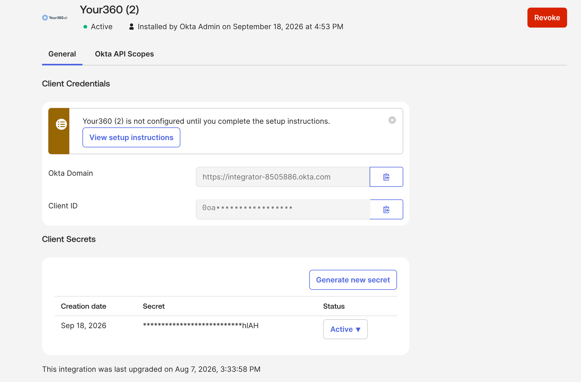 The integration's General tab showing Client Credentials with Okta Domain and Client ID, a Client Secrets section with a Generate new secret button, and a red Revoke button at the top right